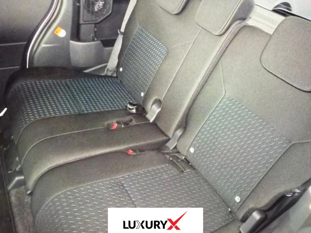 Rear angle of Toyota Roomy GT 2025 with LED tail lamps and rear spoiler