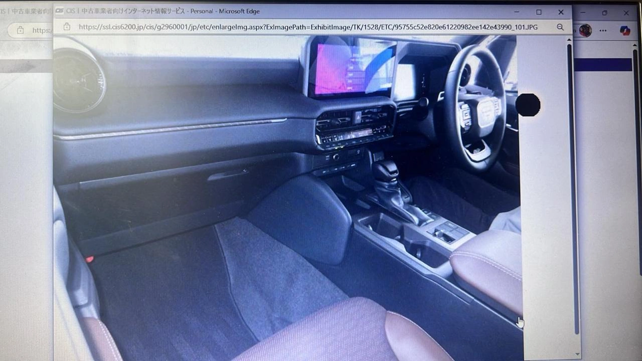 Interior of LC250 First Edition showcasing premium leather seats and infotainment